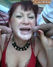 Mature slut sucking two guys from a car